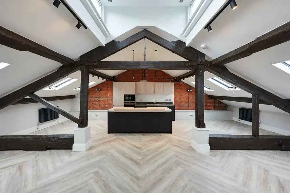 Exposed roof trusses over an open-plan apartment at Bath Street Lofts, Birmingham