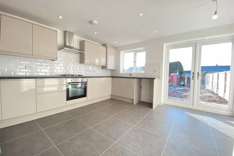 The finished kitchen, with doors to the garden